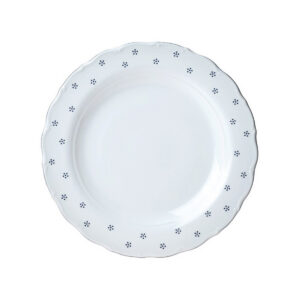 Bílý porcelánový mělký talíř Valbella s vlnitým okrajem a tmavými tečkami.